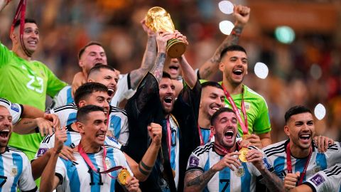 Argentina captain Lionel Messi lifts the FIFA World Cup trophy following victory over France in the FIFA World Cup Final match at the Lusail Stadium in Lusail, Qatar. Picture date: Sunday December 18, 2022. 