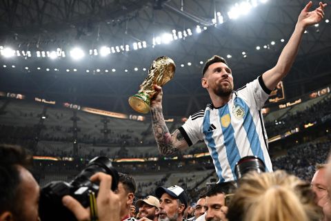 Lionel Messi is carried around the Lusail Stadium in Qatar after Argentina defeated France in the World Cup final in December 2022.
