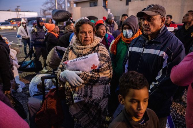 Migrants wait to enter a shelter at the Sacred Heart Church in El Paso on December 17.