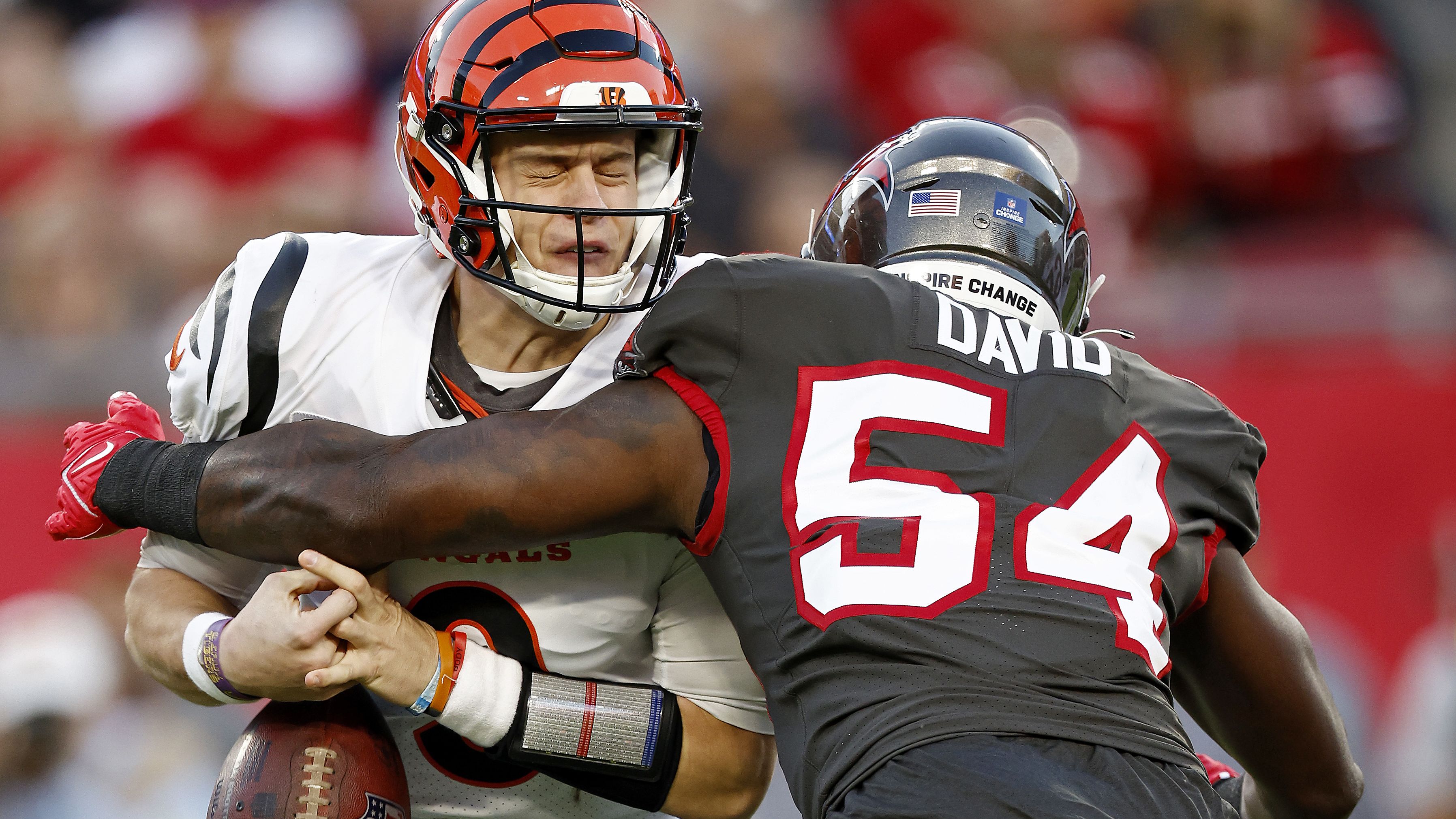 Joe Burrow of the Cincinnati Bengals is sacked by Lavonte David of the Tampa Bay Buccaneers during the second quarter at Raymond James Stadium. Burrow threw four touchdowns as the Bengals overcame a 17-point deficit to beat Tom Brady and the Bucs 34-23.