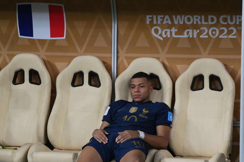 French star Kylian Mbappé sits on the team's bench after the loss.
