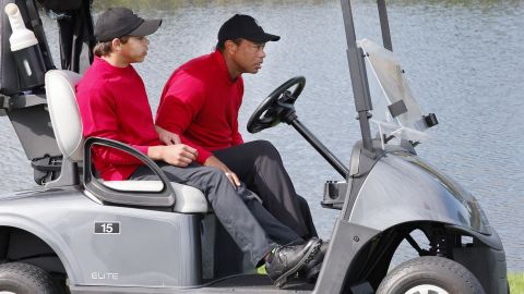 Tiger and Charlie Woods share a cart on Sunday.