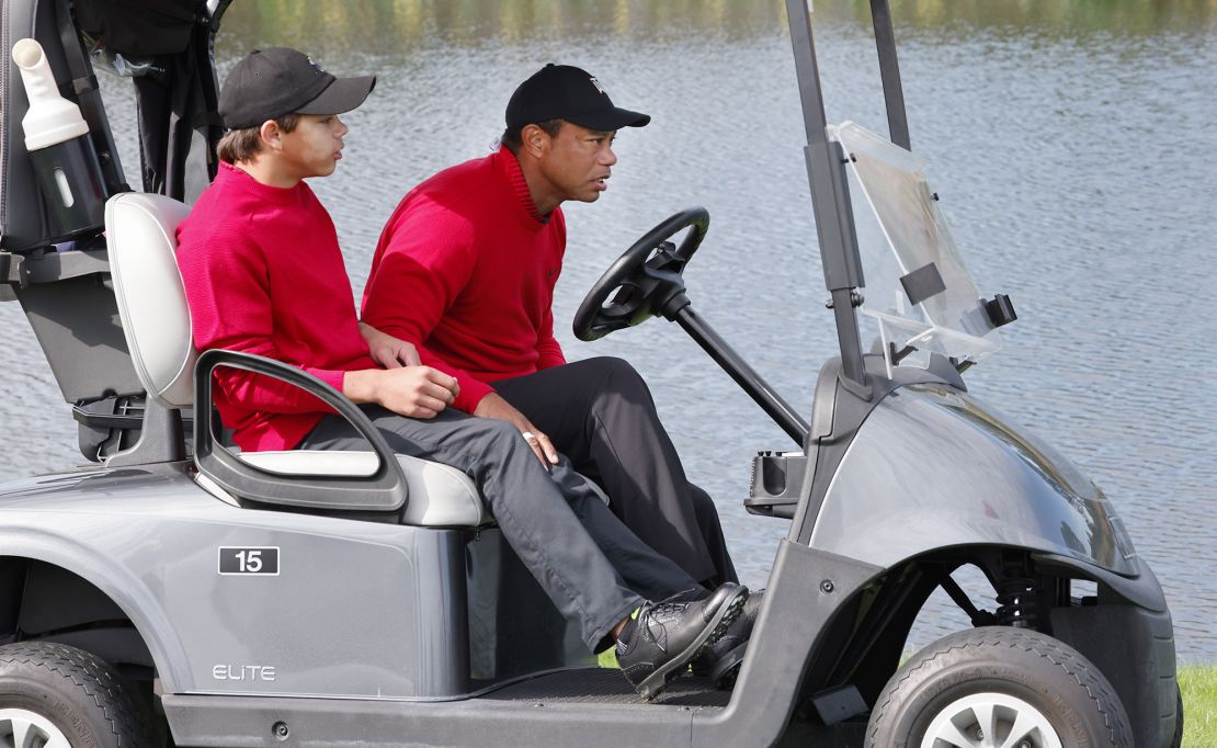 Tiger and Charlie Woods share a cart Sunday.