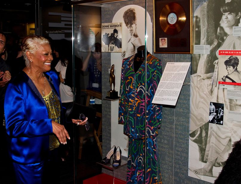 Warwick observes an exhibit about her life at the Grammy Museum before attending an event that celebrated the 50th anniversary of her career in 2012.