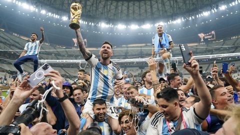 LUSAIL, QATAR - DECEMBER 18: Argentina forward Lionel Messi (10) holds aloft the World Cup trophy after defeating France to win the final match of the FIFA World Cup 2022 between Argentina and France at Lusail Stadium in Lusail, Qatar on December 18, 2022. (Photo by Jabin Botsford/The Washington Post via Getty Images)