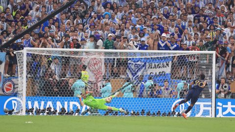 Martinez saves a penalty from France's Kingsley Coman in the World Cup final.  