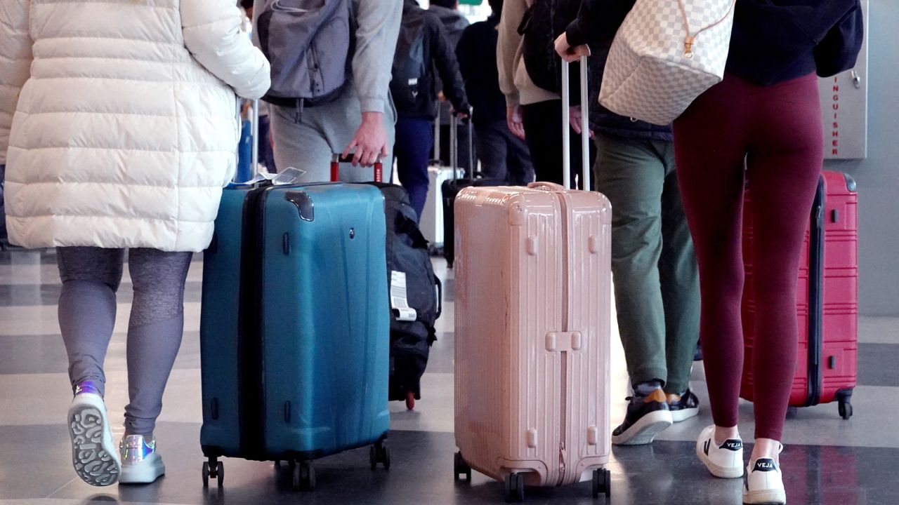 CHICAGO, ILLINOIS - DECEMBER 16: Travelers arrive for flights at O'Hare International Airport on December 16, 2022 in Chicago, Illinois. Airlines are expecting travel this holiday season to be comparable to pre-pandemic levels.  (Photo by Scott Olson/Getty Images)