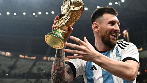 Argentina's captain and forward #10 Lionel Messi holds the FIFA World Cup Trophy following the trophy ceremony after Argentina won the Qatar 2022 World Cup final football match between Argentina and France at Lusail Stadium in Lusail, north of Doha on December 18, 2022. (Photo by Anne-Christine POUJOULAT / AFP) (Photo by ANNE-CHRISTINE POUJOULAT/AFP via Getty Images)