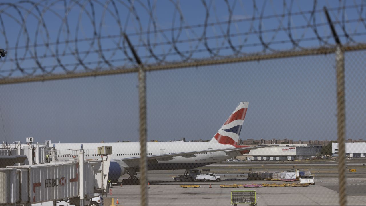 A British Airways plane on the tarmac at Terminal 7 at John F. Kennedy International Airport (JFK) in New York, U.S., on Monday, Sept 27, 2021. The U.S. will soon allow entry to most foreign air travelers as long as they're fully vaccinated against Covid-19 -- while adding a testing requirement for unvaccinated Americans and barring entry for foreigners who haven't gotten shots. Photographer: Angus Mordant/Bloomberg