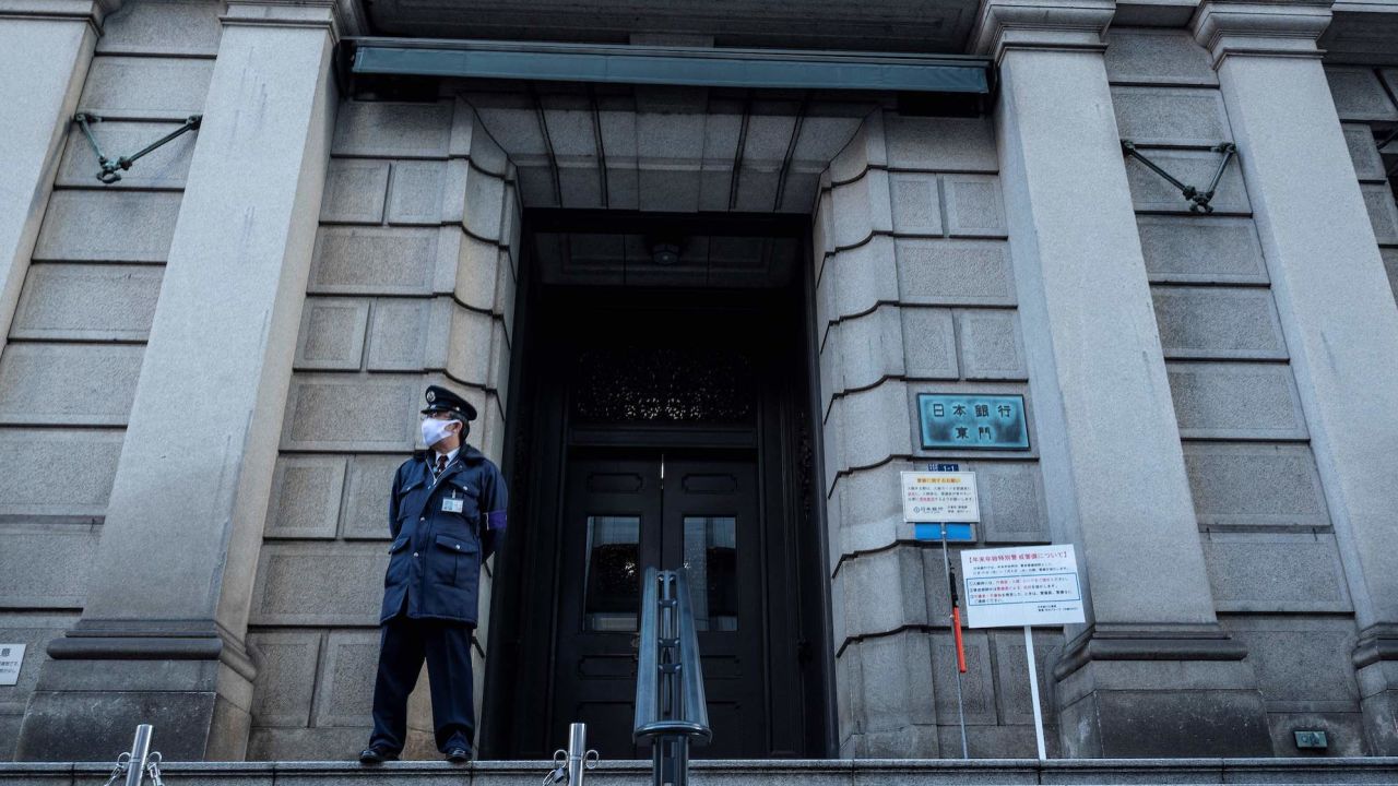 A member of security stands at an entrance to the Bank of Japan headquarters complex in Tokyo on December 20, 2022.  