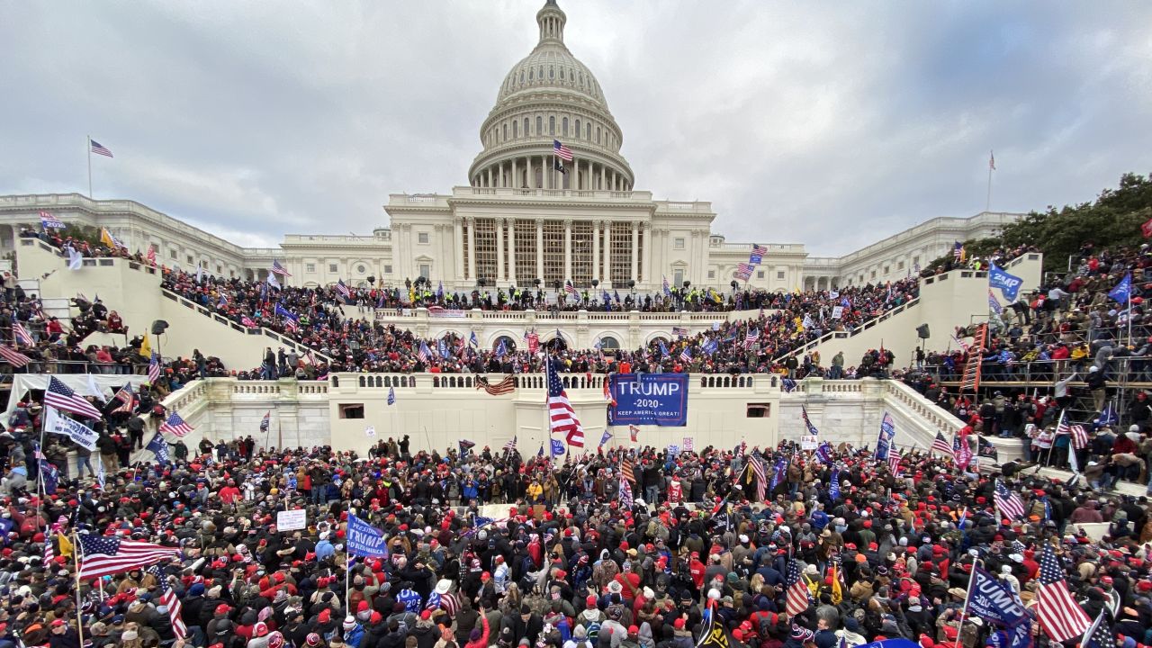 Supporters of President Donald Trump swarm the Capitol building in this January 6, 2021 file photo. 