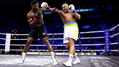 Oleksandr Usyk lands a punch on Anthony Joshua during their 
