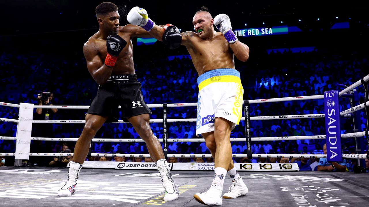 Oleksandr Usyk lands a punch on Anthony Joshua during their "Rage on the Red Sea" heavyweight title fight at King Abdullah Sports City Arena in Jeddah, Saudi Arabia.