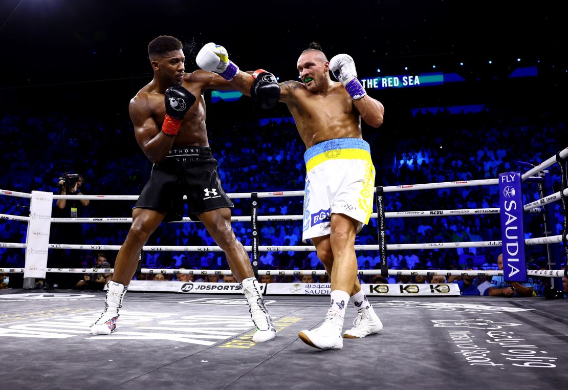 Oleksandr Usyk lands a punch on Anthony Joshua during their "Rage on the Red Sea" heavyweight title fight at King Abdullah Sports City Arena in Jeddah, Saudi Arabia.
