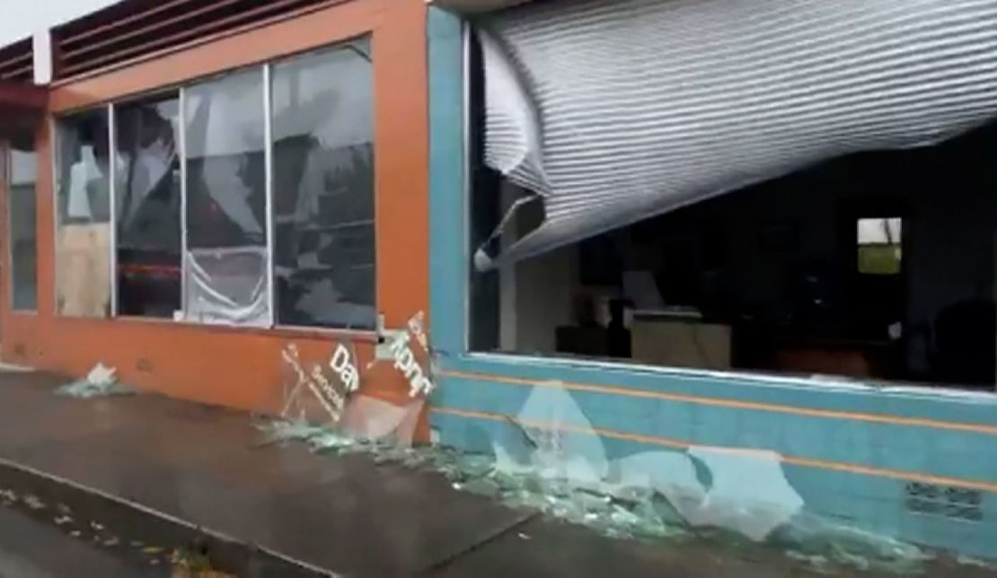 Damaged storefronts are seen in Fortuna, California, on Tuesday.