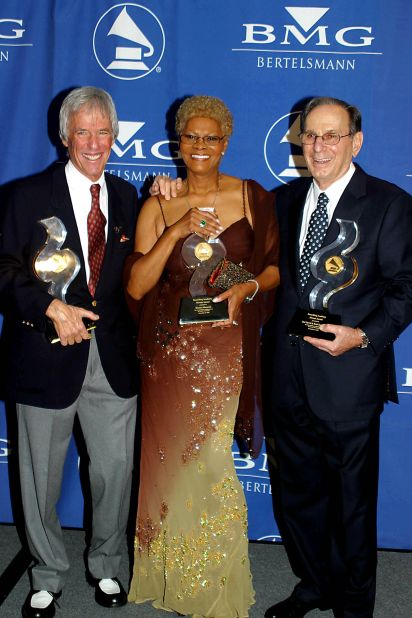 From left, Bacharach, Warwick and Hal David pose with their statues at the NARAS Heroes Awards in 2002. Bacharach and David <a href="https://www.cnn.com/2012/09/02/showbiz/hal-david-last-songs/index.html" target="_blank">co-wrote</a> many of Warwick's hit songs and said she was their muse. 