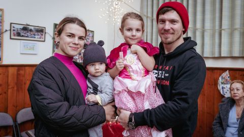 Oleksandra and Igor Kuzmenko, holding their daugher, Miroslava, and their nephew, David.
