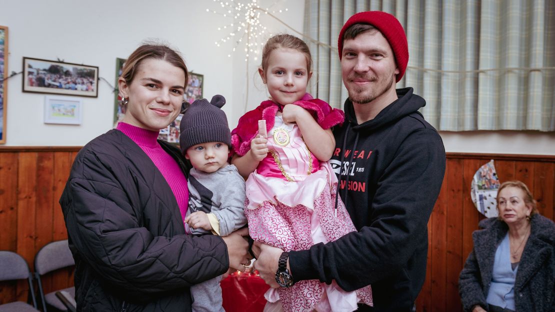 Oleksandra and Igor Kuzmenko, holding their daugher, Miroslava, and their nephew, David.