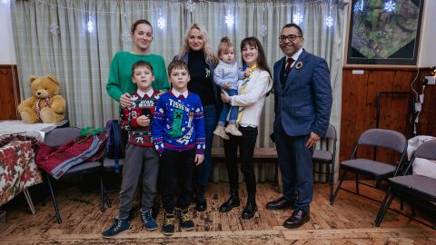 Kandiah and Doroshko with Nadia Ilova and her sons, left, and Valeria Mocharscka-Liulchyk and her daughter, center right.