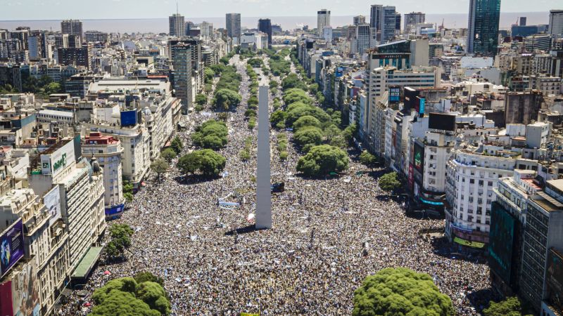 Argentine stars Lionel Messi and Rodrigo De Paul fly in helicopter over parade due to crowd size | CNN