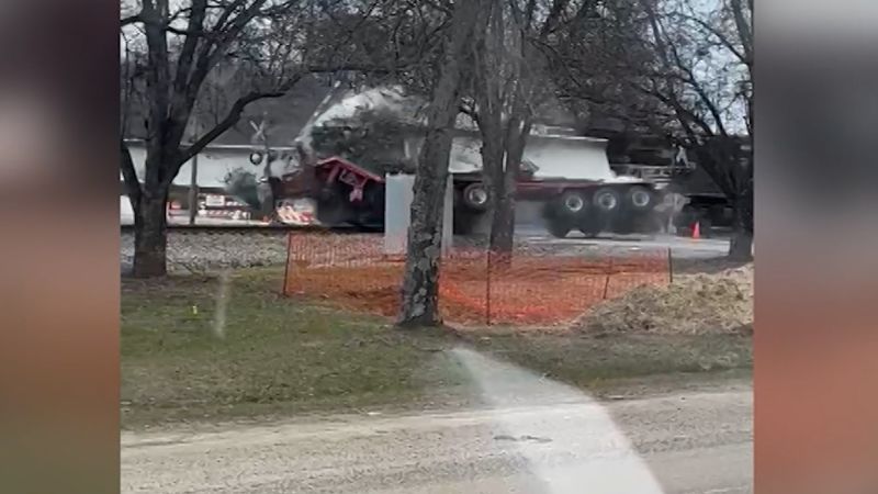 Watch: Truck carrying 134-foot concrete beam demolished by train | CNN