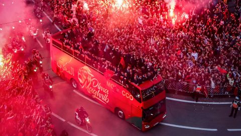 Supporters light flares and cheer as Morocco's national football team returns home in the capital Rabat, on Tuesday, after their record-breaking World Cup campaign. 