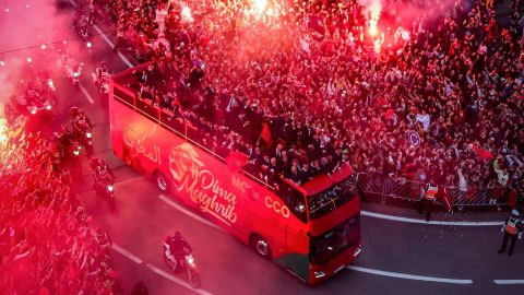 Supporters light flares and cheer as Morocco's national football team returns home in the capital Rabat, on Tuesday, after their record-breaking World Cup campaign.