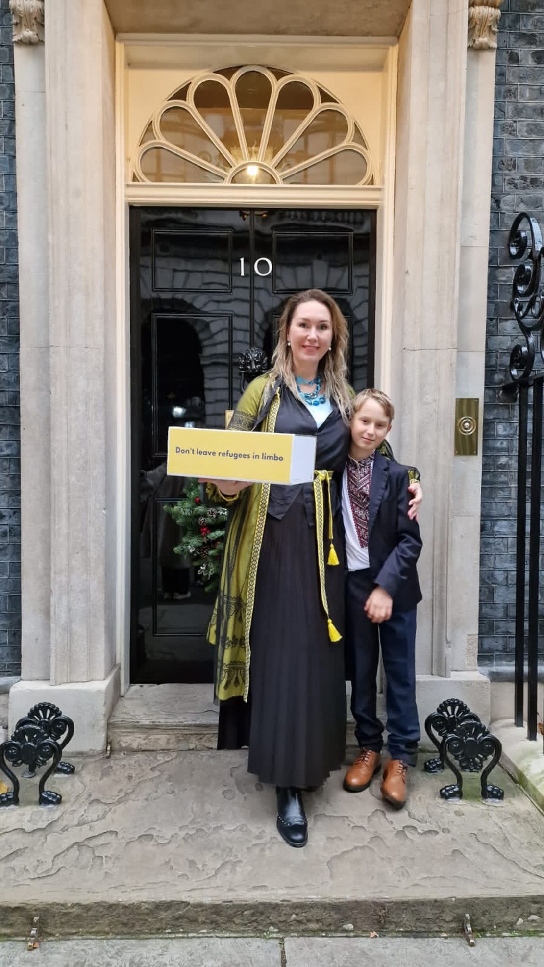 Tania Orlova and her son, Danylo, delivering a petition to 10 Downing Street, asking for more support for Ukrainian refugees in the UK.
