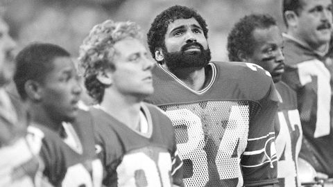 Running back Franco Harris (34) stands with Seattle Seahawks teammates before the game against San Diego, Sept. 11, 1984, in Seattle. Harris joined the Seattle Seahawks after Curt Warner suffered a knee injury in the Seahawks season opener. Seattle won 31-17.
