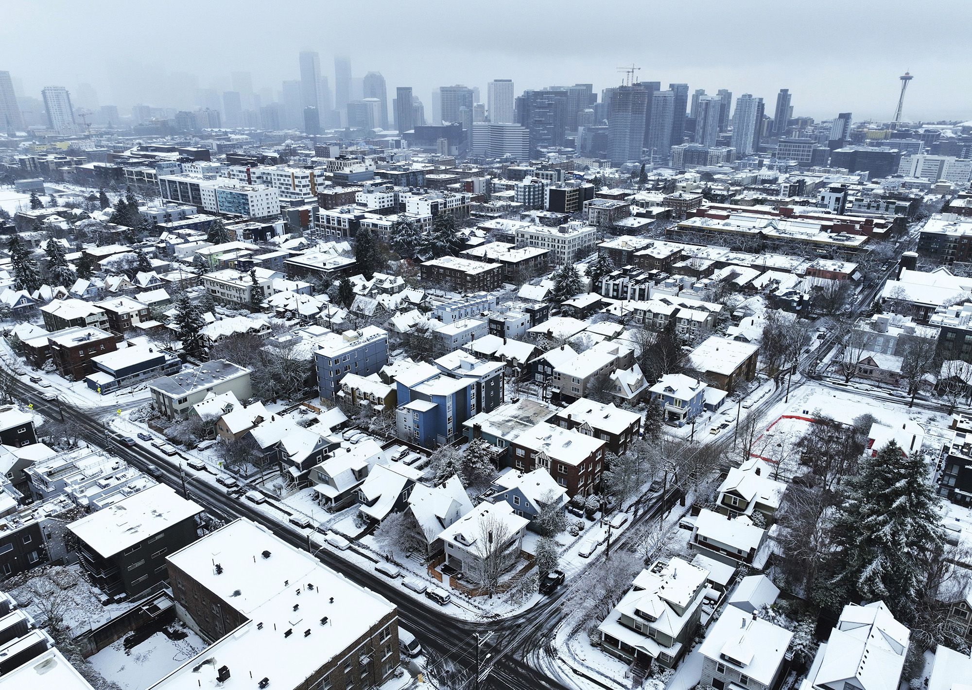 Snow covers homes in Seattle on Tuesday, December 20.