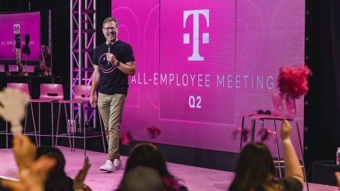 T-Mobile CEO Mike Sievert talks to employees at a 2022 company event.