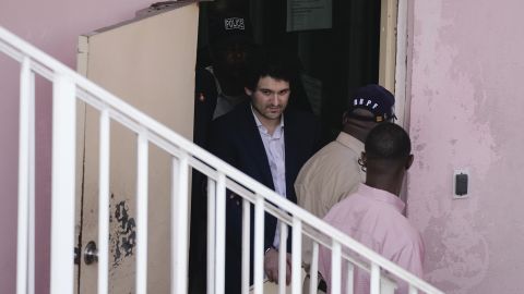 Sam Bankman-Fried Seeks Bail Deal While Being Extradited To US - CNN 2 Sam Bankman-Fried is escorted out of court following a hearing in the Bahamas on Monday.