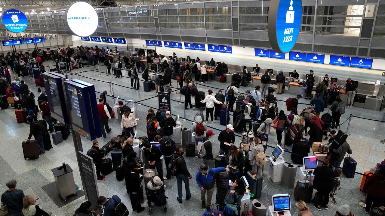 Travelers check in at Minneapolis' St. Paul Airport, Wednesday, December 21, 2022.