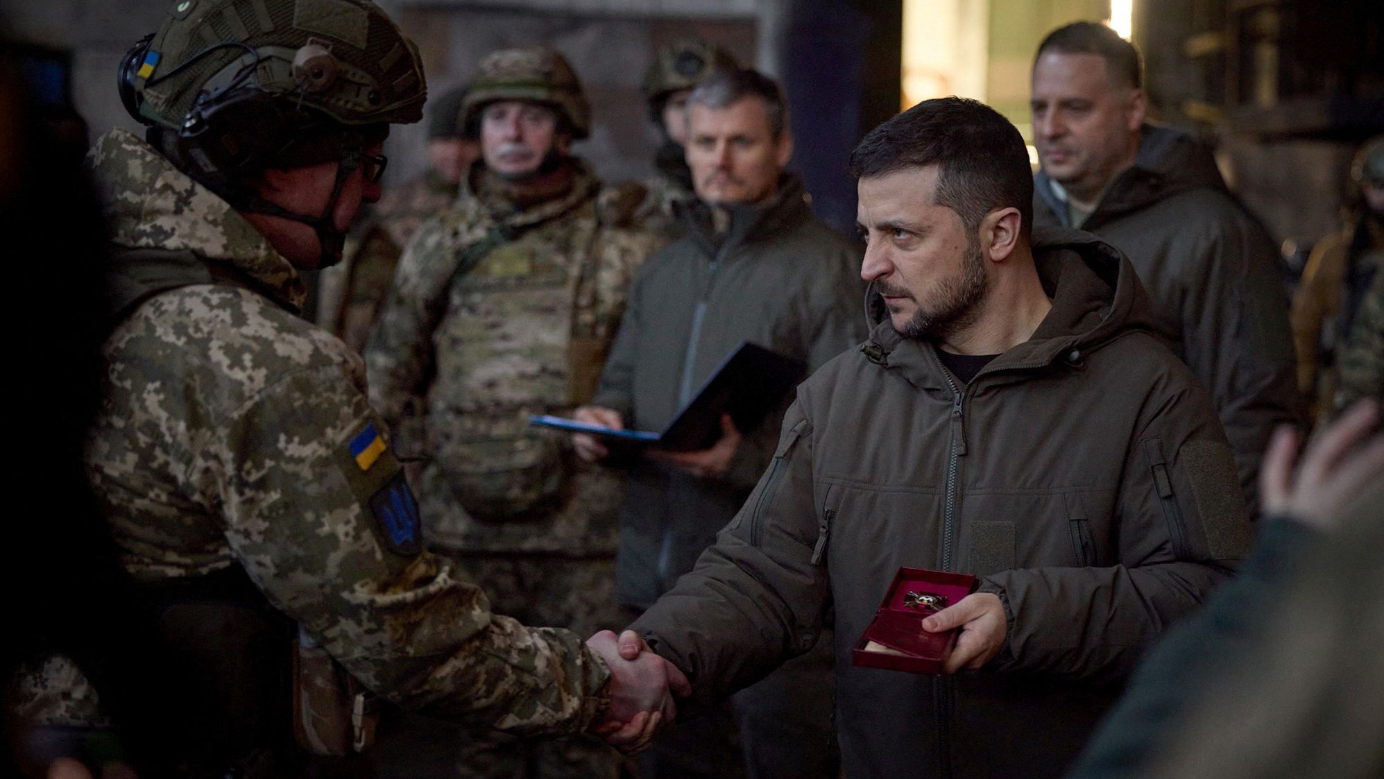 Ukraine's President Volodymyr Zelenskiy awards a Ukrainian service member at a position in the frontline town of Bakhmut, amid Russia's attack on Ukraine, in Donetsk region, Ukraine December 20, 2022. Ukrainian Presidential Press Service/Handout via REUTERS ATTENTION EDITORS - THIS IMAGE HAS BEEN SUPPLIED BY A THIRD PARTY.

