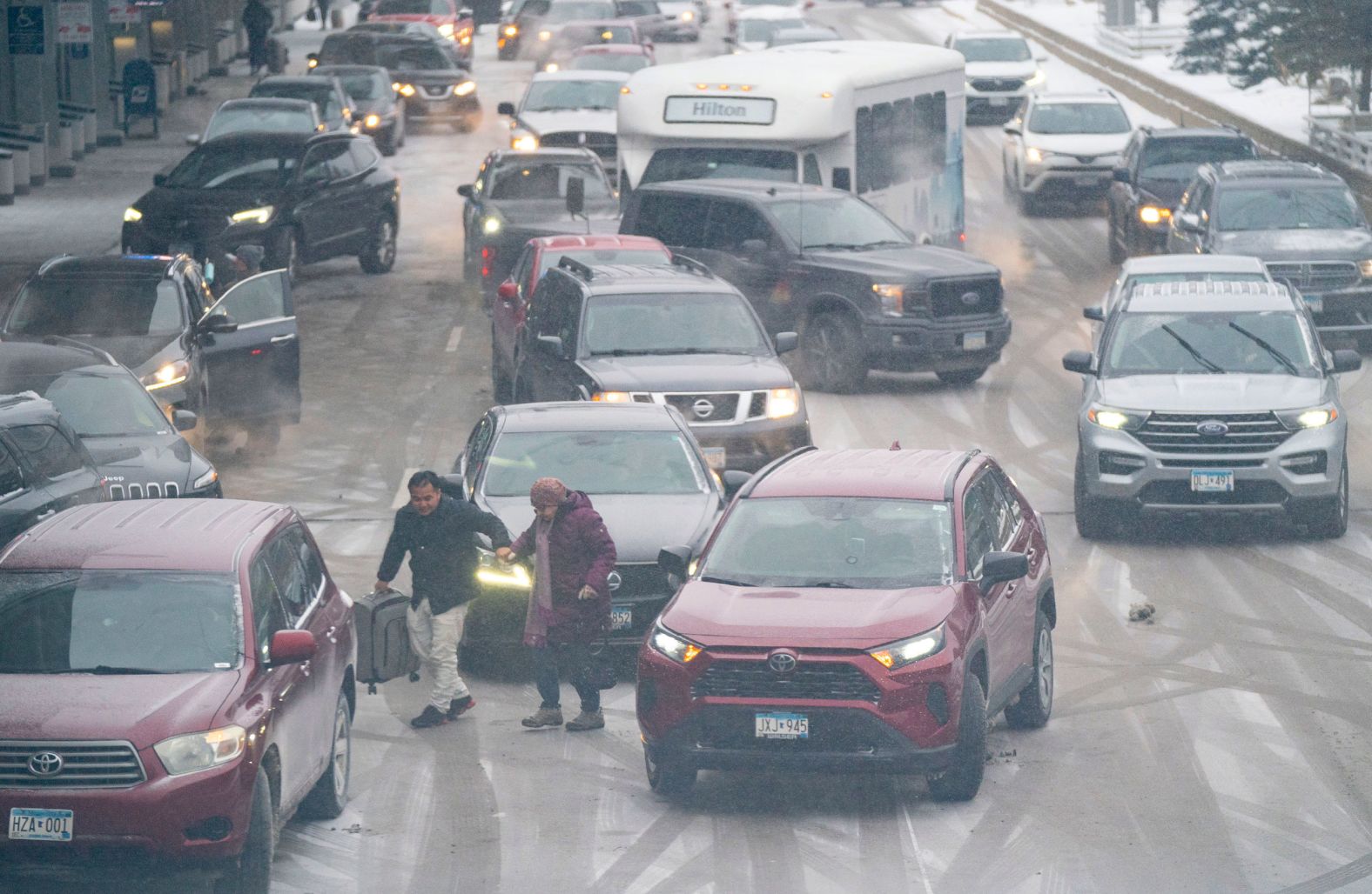 Travelers arrive at the Minneapolis-Saint Paul International Airport on December 21.