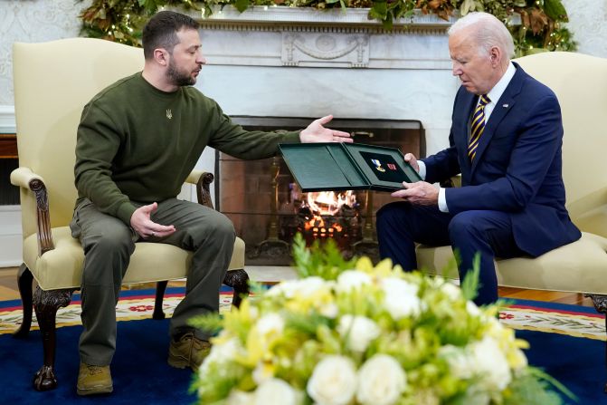 Zelensky speaks after giving Biden a gift. He <a href="index.php?page=&url=https%3A%2F%2Fwww.cnn.com%2Feurope%2Flive-news%2Frussia-ukraine-war-news-12-21-22%2Fh_5daaaace8ac5173e9d501b3b86978113" target="_blank">presented Biden</a> with a Cross of Combat Merit. Zelensky explained that a captain in the Ukrainian military fighting in the Donbas region asked that his award be given to Biden.