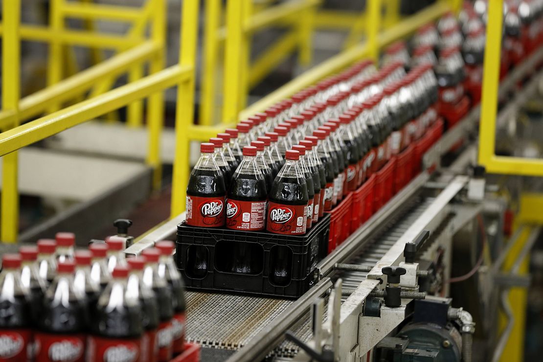 Bottles of Dr. Pepper move down a production line at the Swire Coca-Cola bottling plant in Utah.