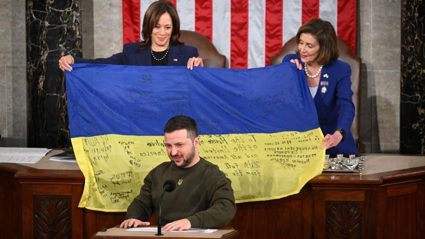 Ukraine's President Volodymyr Zelensky speaks during a joint session of Congress, with Vice President Kamala Harris, left, and House Speaker Nancy Pelosi, D, on Wednesday, Dec. 21, 2022. -CA) carries a Ukrainian flag at the U.S. Capitol in Washington, DC.  -