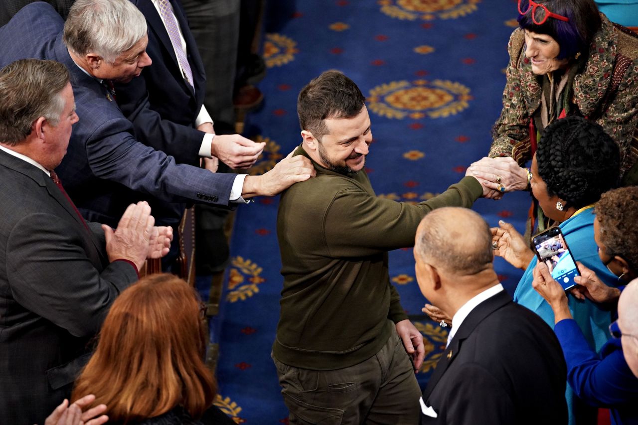 Zelensky is greeted as he arrives to address Congress.