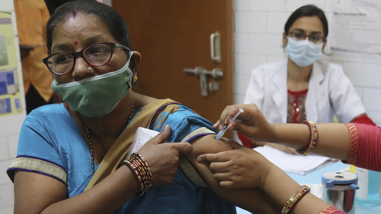 A health worker administers a Covid vaccine booster dose in New Delhi.