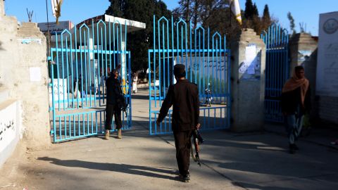 Taliban security personnel stand guard at the entrance to a university in Jalalabad on December 21, 2022. 