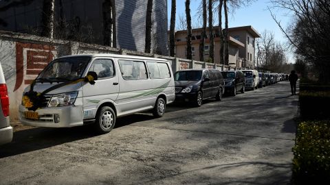 A hearse lines up to enter a crematorium in Beijing on Dec. 22.