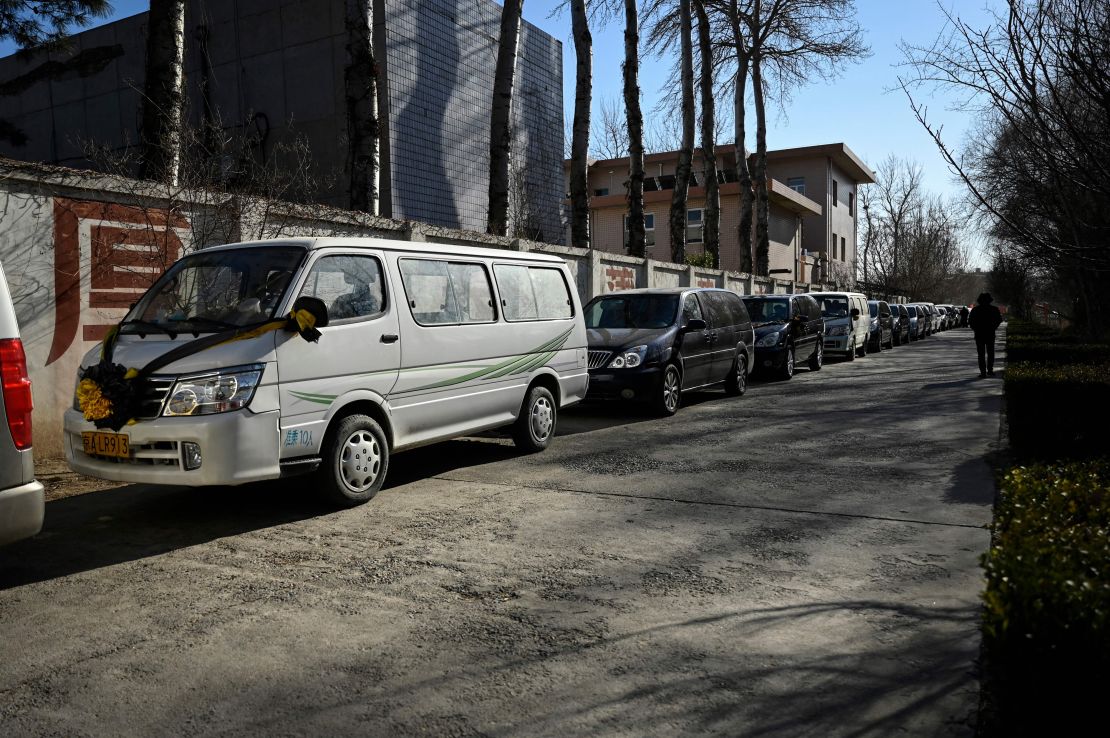 Hearses queue up to enter a crematorium in Beijing on December 22.
