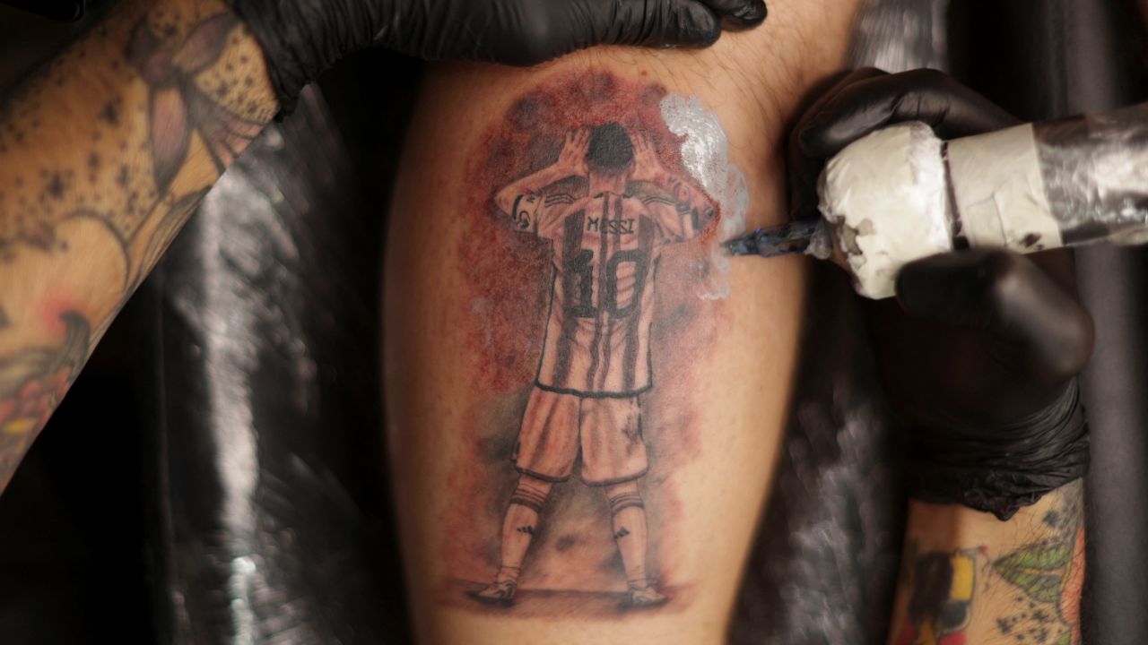 Fermin Robilotte, 27, gets a tattoo of Argentina's World Cup winning captain.
