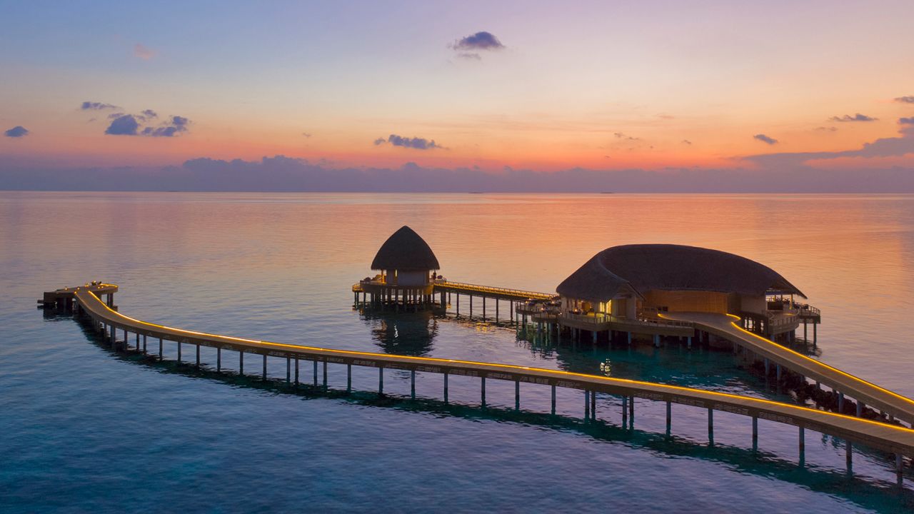 Beach villas and overwater villas house guests at luxurious Emerald Faarufushi.