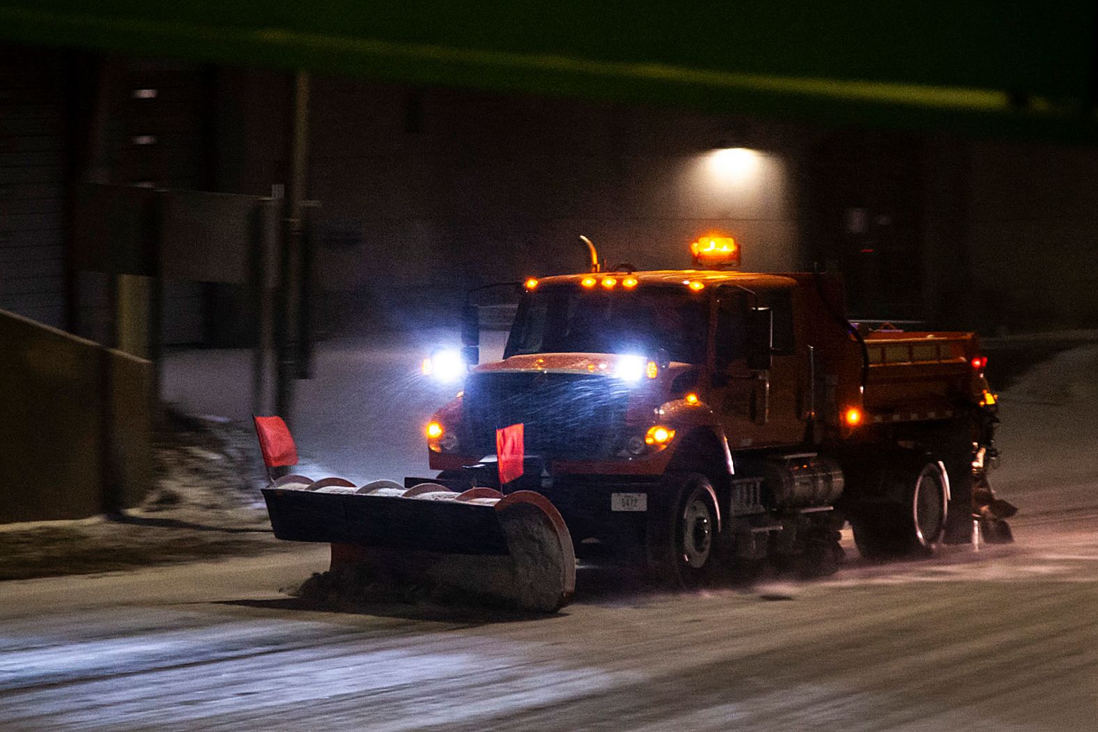 An Iowa Department of Transportation plow clears a road in Iowa City on December 21.