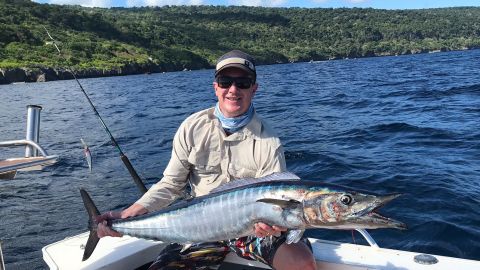 Christmas Island is an angler's dream destination. Lauren Taylor's husband, Brendan, proudly displays a catch.