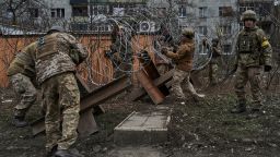 Ukrainian soldiers prepare barricades in Bakhmut, Donetsk region, Ukraine, Wednesday, Dec. 21, 2022. (AP Photo/Libkos)