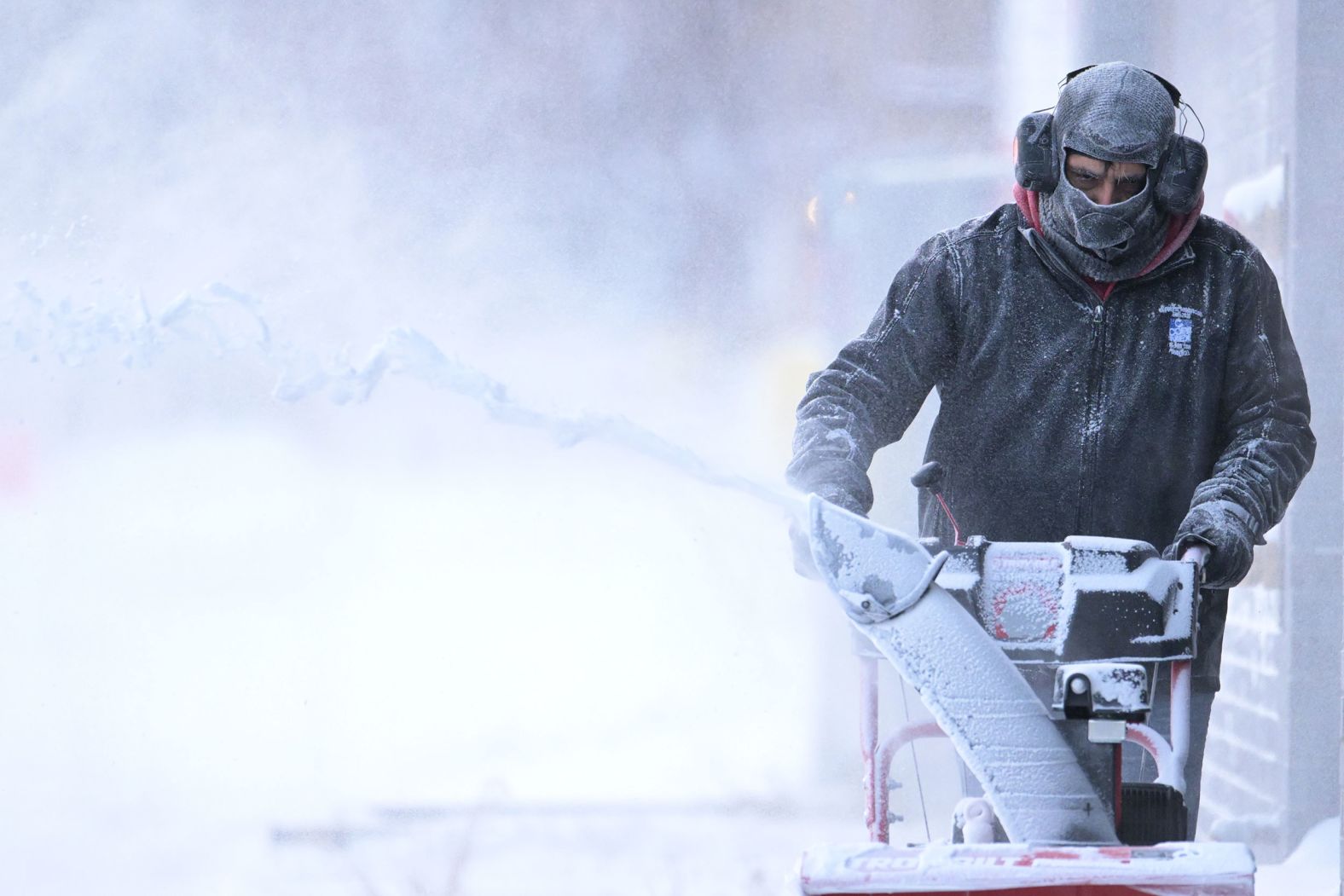 Miguel Salazar clears sidewalks in Denver on December 22.