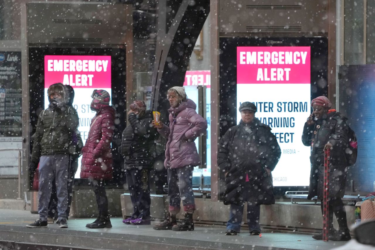 Bus riders wait at a sheltered stop in Chicago on December 22.
